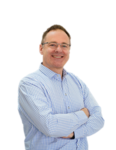 A photo of Peter Furlong. Peter has short brown hair, and is wearing a light blue checkered shirt along with glasses.