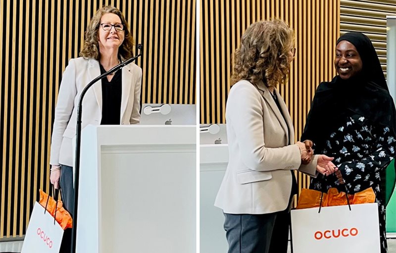 Two photos side by side. The photo on the left shows Josephine Austin behind a small podium holding an Ocuco branded bag. The photo on the right shows Josephine handing the bag to a young female university student.